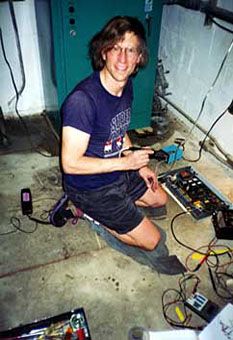 Chief Engineer Jim Duncan modifying Gentner remote control at KUFX, Loma Prieta Peak, California 1992