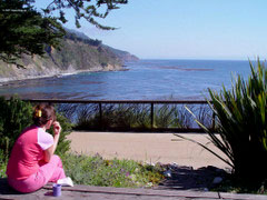 Woman enjoying Big Sur Coast view from Esalen
